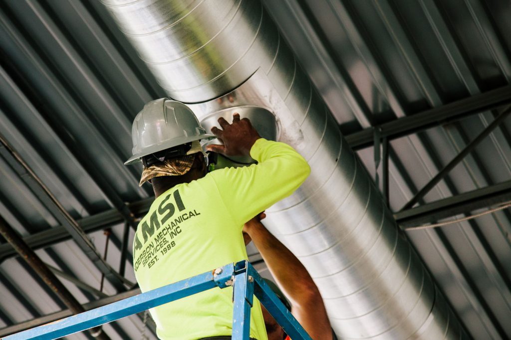 Mechanical Construction Contractor fixing Ductwork. AMSI | Servicing Virginia, Washington DC & Maryland